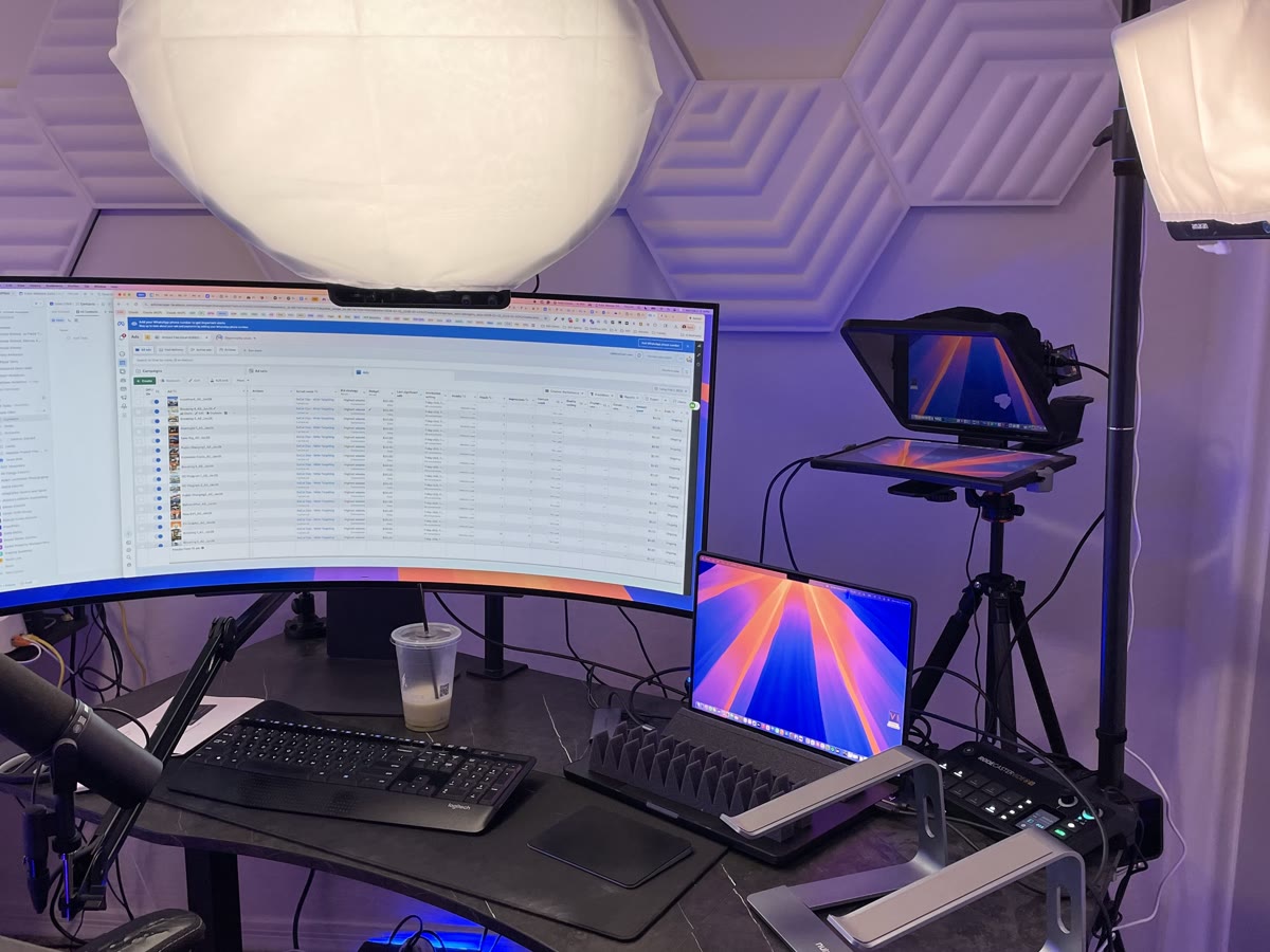 Camera side of Matthew Anderson's studio with acoustic panels and teleprompter