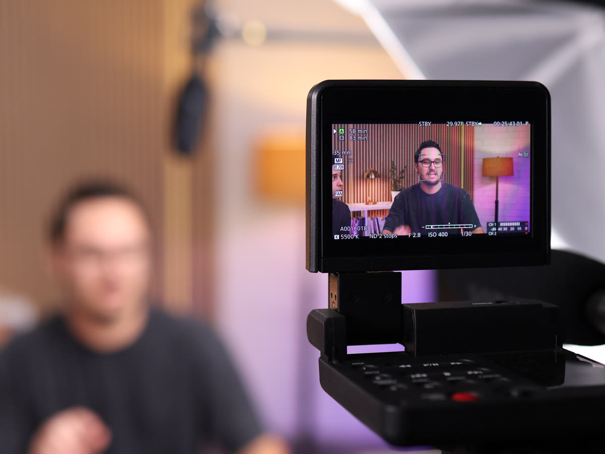 Camera monitor framing a guest in Shawn Zajas's studio